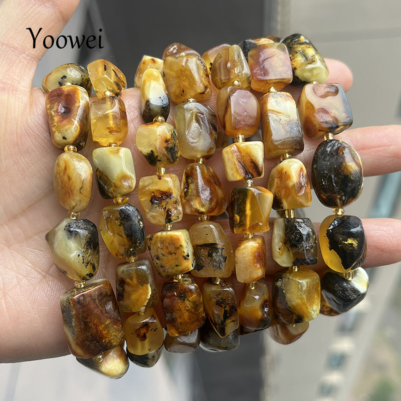 Gemstone Bracelet Healing - กำไลข้อมืออำพันแท้ 100% สำหรับทุกเพศ ดีไซน์ไม่ซ้ำใคร ทำด้วยมือ ประดับด้วยลูกปัดสีขาวจากพืช